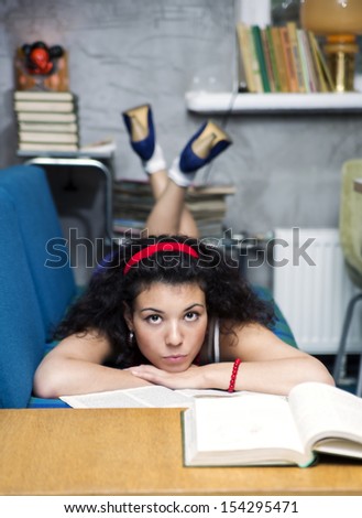 Young woman lay on soft sofa and thinking