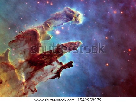 Somewhere in deep space. Pillars of creations and space dust. Science fiction wallpaper. Elements of this image were furnished by NASA.