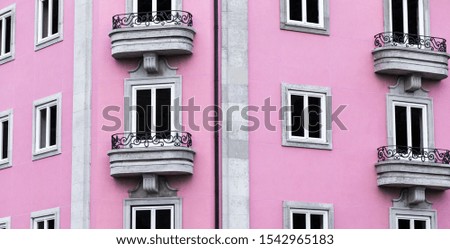 Symmetric Windows from a Pink building in Braga, Portugal.
