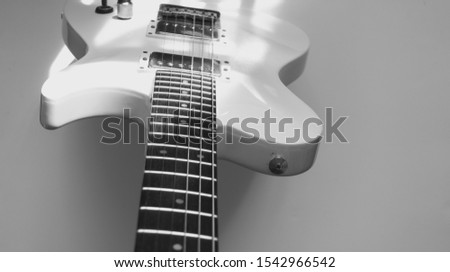 white guitar on white background . black and white                             