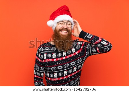 Christmas man with long beard over isolated red background has realized something and intending the solution