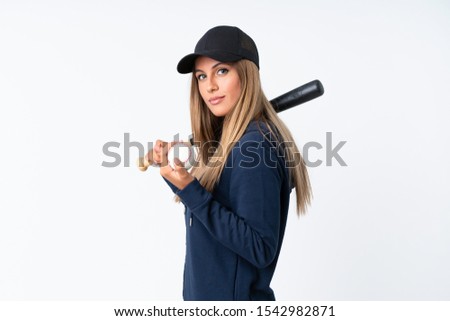 Young blonde woman playing baseball over isolated background