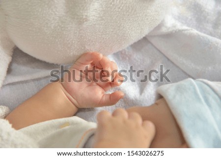 Little hand of sleeping baby newborn.