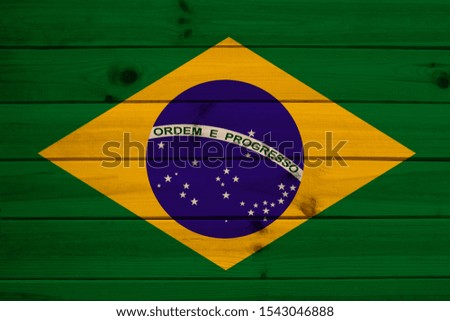 photo of the national flag of Brazil on a luxurious texture of satin, silk with waves, folds and highlights, close-up, copy space, travel concept, economy and state policy