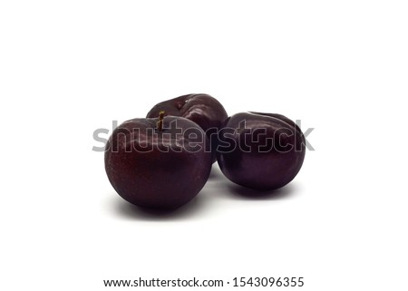 Three cherry plum isolated on white background.