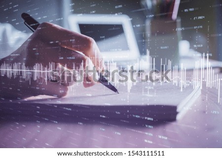 Financial charts displayed on woman's hand taking notes background. Concept of research. Double exposure