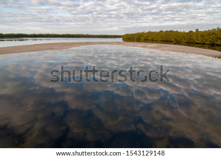 Early moning cloudscape over Ding Darling National Wildlife Refuge on Sanibel Island, Florida in winter. Royalty-Free Stock Photo #1543129148