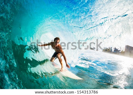 Surfer on Blue Ocean Wave in the Tube Getting Barreled Royalty-Free Stock Photo #154313786