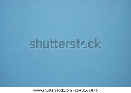 The blue cement wall is used as the background.
