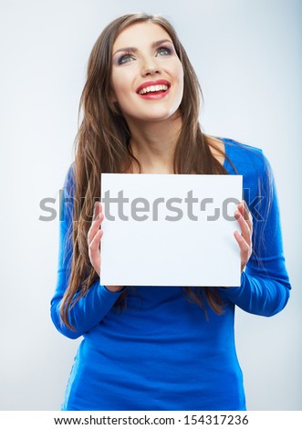 Teenager girl hold white blank paper. Young smiling woman show blank card. Girl portrait isolated on white background.