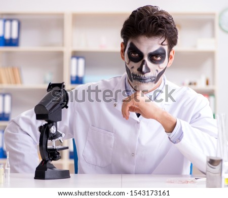 Scary monster doctor working in lab Royalty-Free Stock Photo #1543173161
