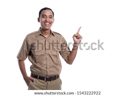 indonesia government worker with brown uniform pointing to copy space isolated