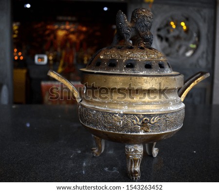 Golden incense burner at a Chinese temple