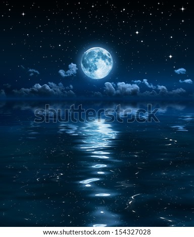 super moon and clouds in the night on sea 