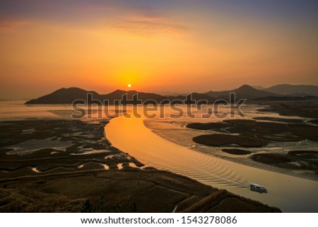 Sunset of Suncheonman bay in the winter. Royalty-Free Stock Photo #1543278086