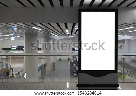 Blank billboard indoors of metro or airport hall, advertising mock up, public information board. Blur Background 