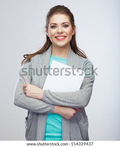 Teenager girl hold white blank banner. Young smiling woman show blank card. Girl portrait 