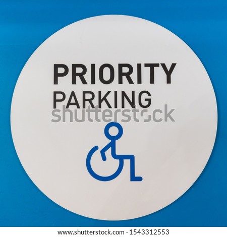 Blue disabled parking symbol on a white background