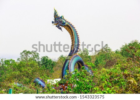 The Naga statue, body length 122 meters, diameter 1.50 meters, height about 20 meters, beautiful and spectacular on the high mountains of Wat Phu Manorom Mukdahan, Thailand