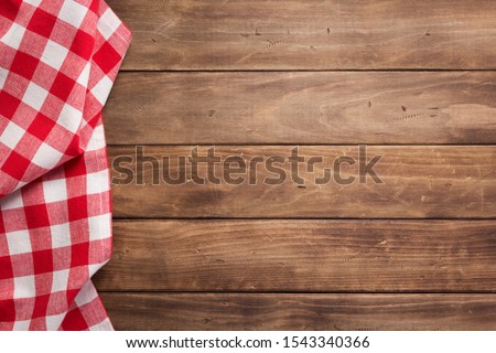 cloth napkin on at rustic wooden plank board table background, top view