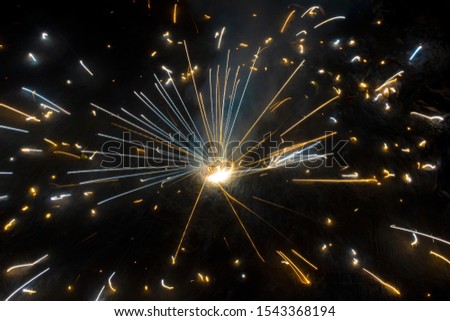 A type of firecracker or chakri spinning on the ground,during the Diwali festival celebrations in India.