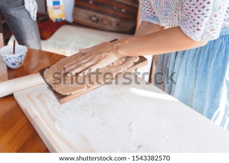Budapest, Hungary - October 19, 2109: Traditional home-made gingerbread baking. Gingerbread with wooden press technique.