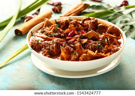 Delicious and spicy mutton, gosht masala curry-Indian recipes background.