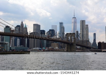 View from the Brooklyn for Manhattan skyscrappers, river and the Brooklyn bridge  