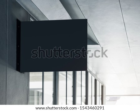 Shop sign Mock up black signage on Building exterior