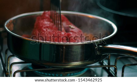 meat cooked on a burning stove