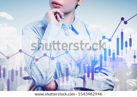 Unrecognizable pensive businesswoman standing in modern city with double exposure of digital charts. Concept of trading and decision making. Toned image