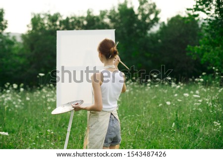 young woman model with brush in hand girl model