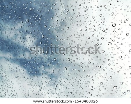 Raindrops falling on the glass