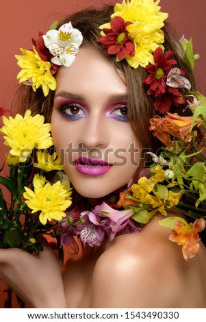 Beauty girls with flowers on a red background