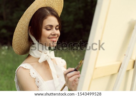 young woman with beautiful hat outdoors model