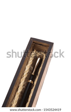 Beautiful wooden box with ballpoint pen inside on a white background.