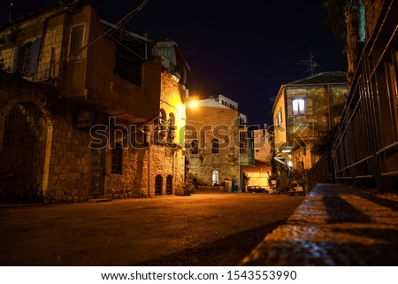A narrow street in Jerusalem at night