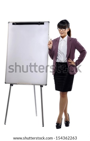 Young attractive business woman standing with a flipchart isolated over white background