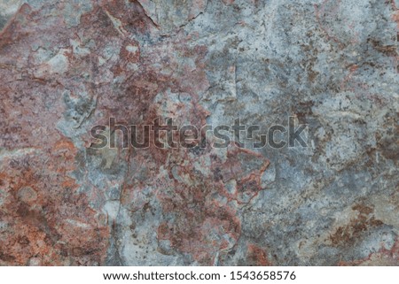 Texture with rock and mauve and gray tones.