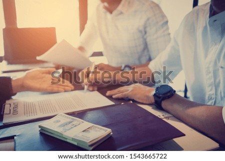 Business people handshaking to sign contract of business at business meeting