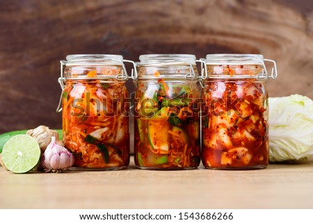 Kimchi cabbage, cucumber and radish in a jar, Korean food Royalty-Free Stock Photo #1543686266