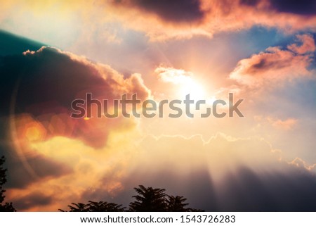 view of beautiful sunset, sky with a sun with rays of light breaking the clouds