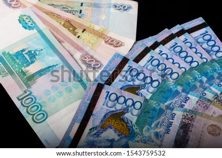 Tenge, Kazakhstan and the Russian ruble. Exchange rate. Bank, world economy, crisis, Finance. Dollar rate. Banknotes of different countries. Eurasian economic Union Royalty-Free Stock Photo #1543759532