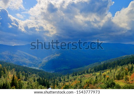 Photo taken in Ukraine. The picture shows the landscape of the Carpathian Mountains in autumn decoration, after a rainfall.