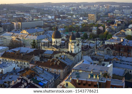 Warm autumn days in Lviv. Panorama of the old part of the city. View from the Town Hall to the Church of the Transfiguration of the Lord. Evening Lviv. Ukraine.