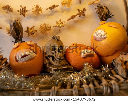 picture with smiling orange face and skull, suitable for Halloween
