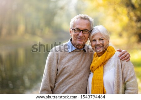 Happy senior couple in autumn park
 Royalty-Free Stock Photo #1543794464