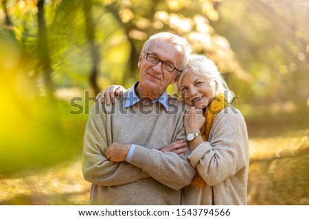 Happy senior couple in autumn park
 Royalty-Free Stock Photo #1543794566