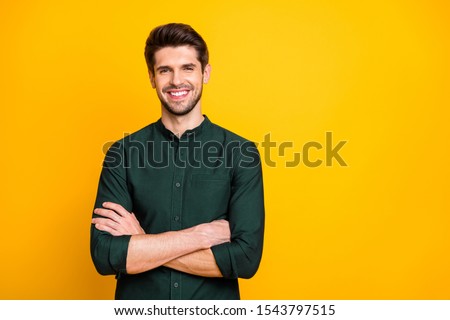 Portrait of confident cool entrepreneur guy cross hands look feel positive cheerful emotions real professional expert wear casual style clothing isolated over yellow color background