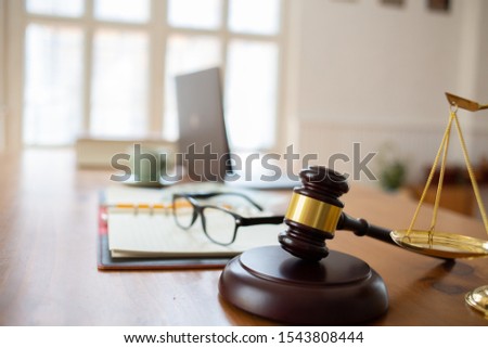 Justice law Scales and books and wooden gavel tool on desk in  Lawyer office.concept Royalty-Free Stock Photo #1543808444